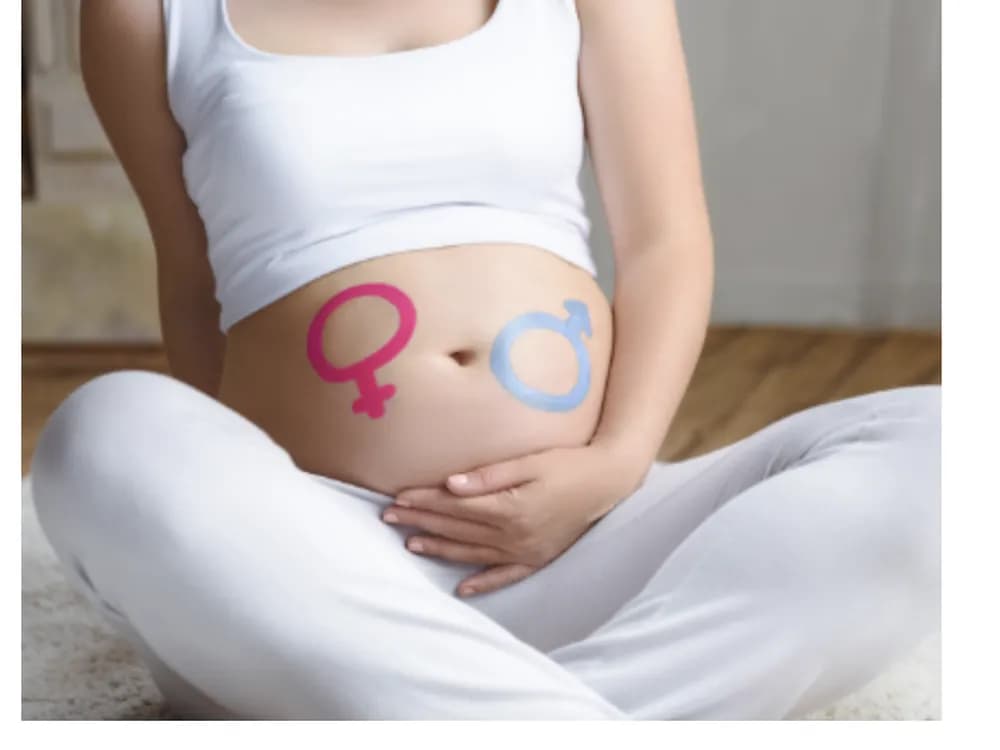 Bump with boy and girl symbols, early gender blood test